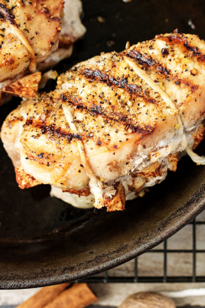 Pork chops stuffed with cinnamon, ginger, and nutmeg flavored apples.