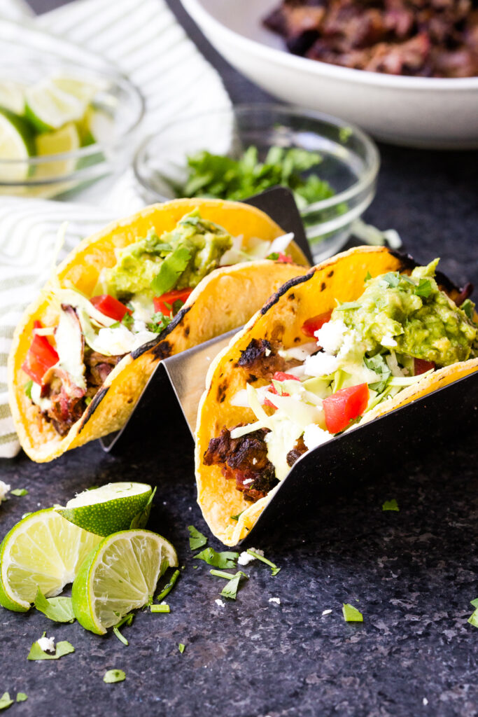 Shredded beef tacos made with smoked chuck roast and corn tortillas