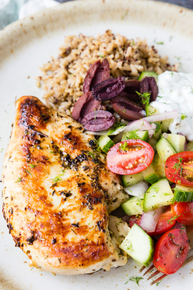 Skillet greek Chicken birds eye close up barely showing plate