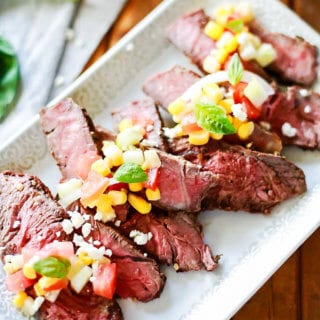 Steak marinated in greek seasoning with a corn and feta relish