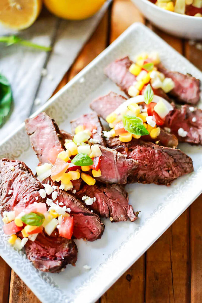 Steak marinated in greek seasoning with a corn and feta relish