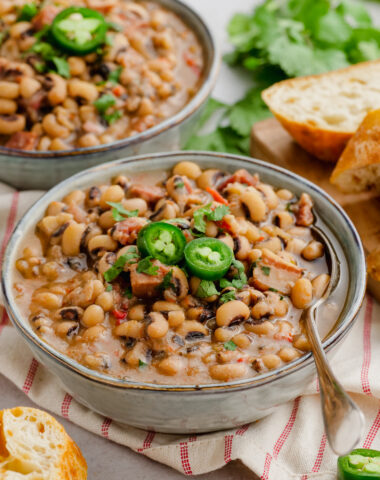 Black Eyed Beas in a grey bowl with spoon. to the side