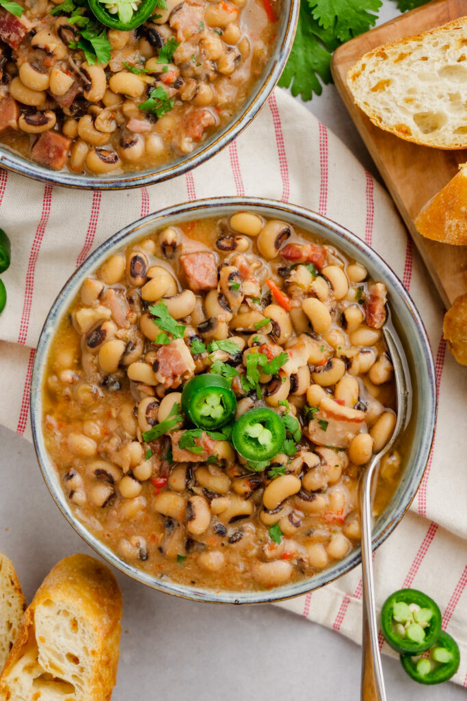 Black eyed peas in a bowl, garnished with jalapenos