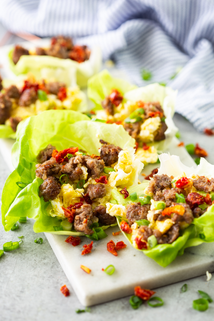 breakfast lettuce wraps on a white board