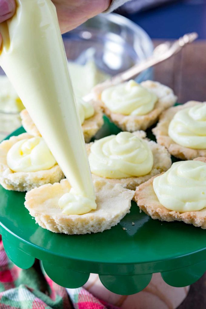 Filling the cherry cheesecake tarts