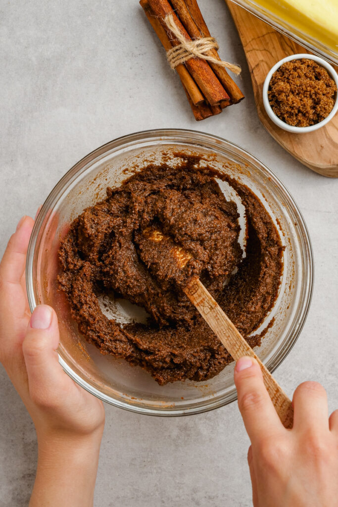 Glass bowl full of cinnamon roll filling. 