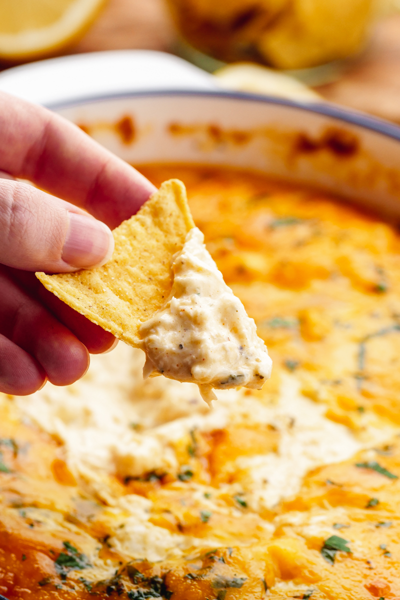 a casserole of crab dip, and a tortilla chip dipper. 