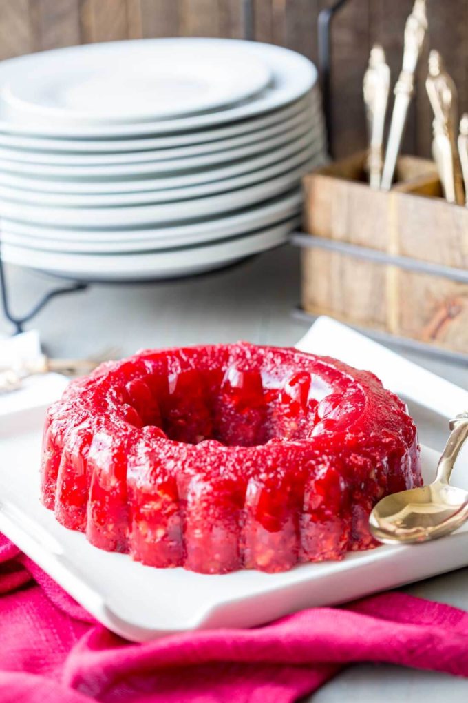 Cranberry Jello Recipe: A combination of orange juice, cranberry juice, crunchy walnuts, celery, and pineapple that will make your holiday unforgettably sweet.