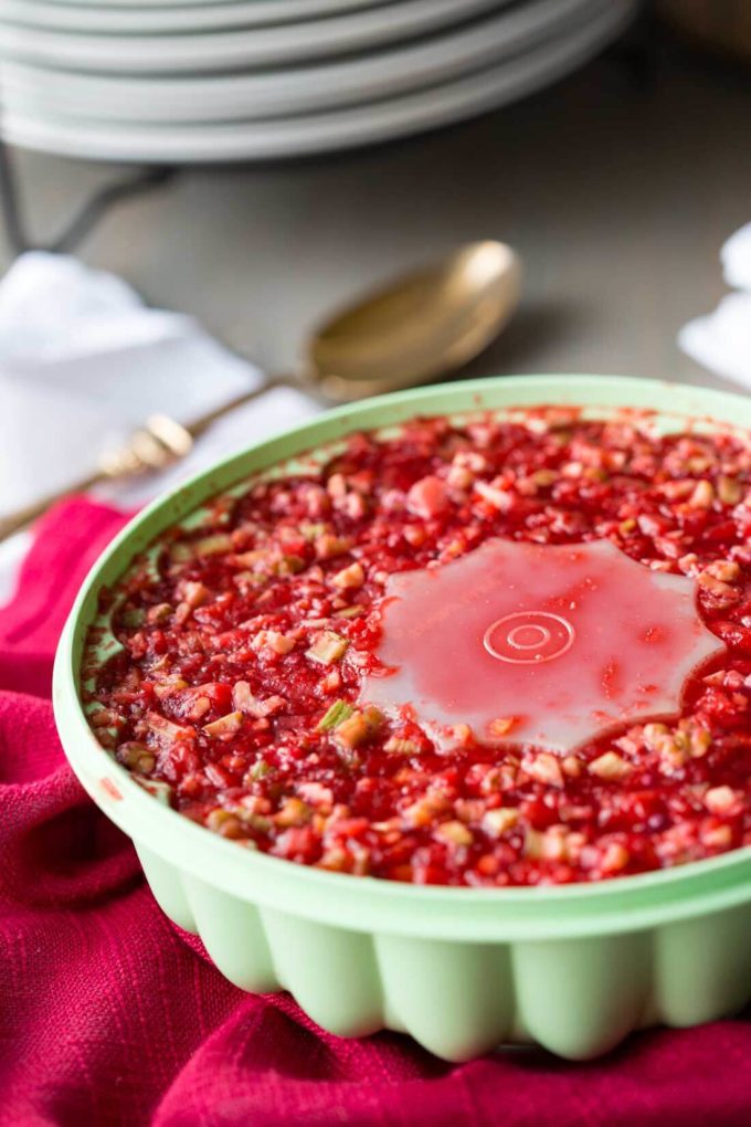 Cranberry Salad with Jello: A combination of orange juice, cranberry juice, crunchy walnuts, celery, and pineapple that will make your holiday unforgettably sweet.