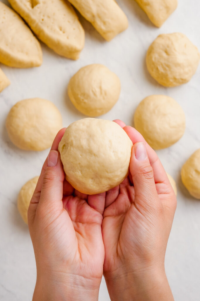 Forming dinner rolls into the right shape