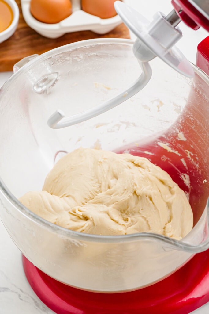 Mix dinner rolls until they come away from the sides cleanly. 