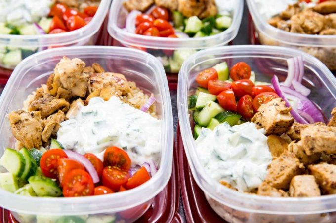 Greek Bowl: Insanely delicious Greek Chicken bowl recipes. Greek Marinated Chicken, cucumber salad, tzatziki, red onion, and tomato, served over brown rice. These are quick and easy to make, and will help you be set for the week.