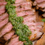 Grilled skirt steak topped with chimichurri
