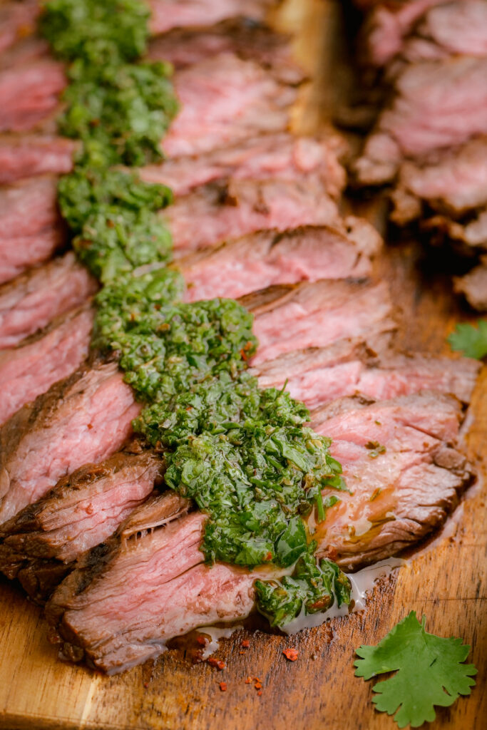 Grilled skirt steak topped with chimichurri