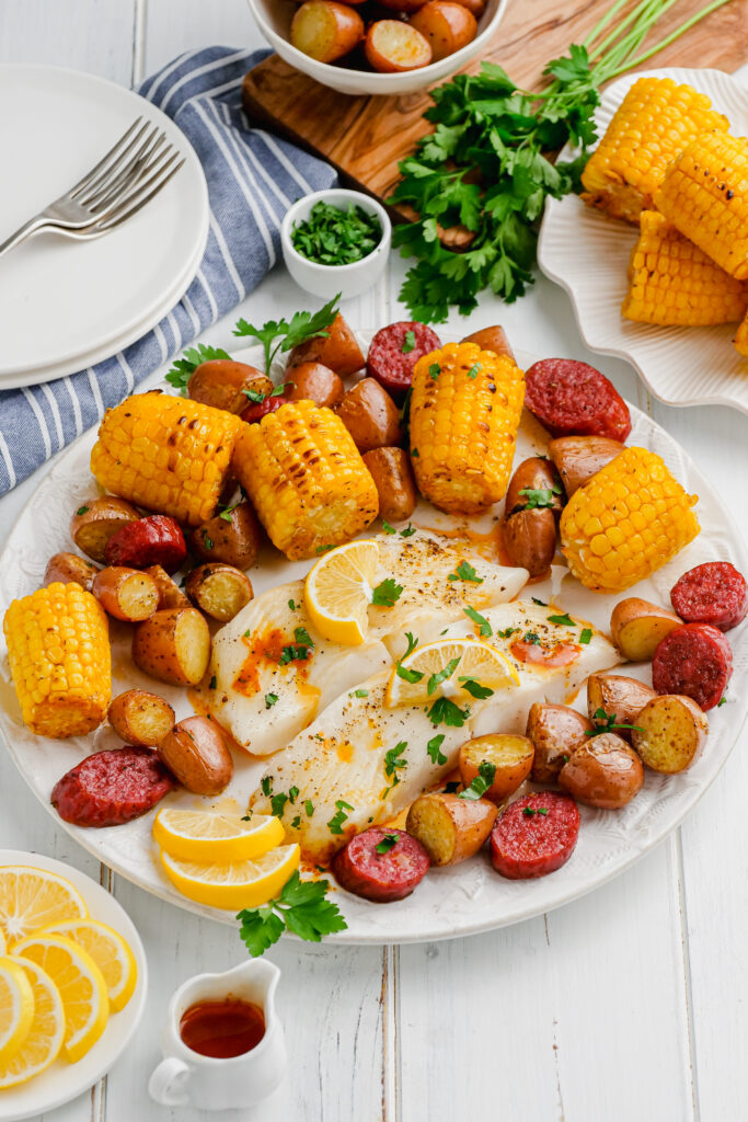 Roasted Halibut Sheet Pan Dinner on a white plate.