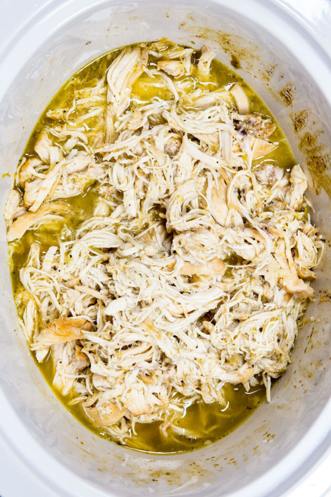 This crock pot or slow cooker honey lime chicken tacos recipe is the best thing ever. Super flavorful chicken, and a perfect party food. 