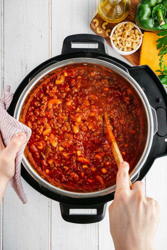 An instant pot with elbow macaroni in tomato sauce