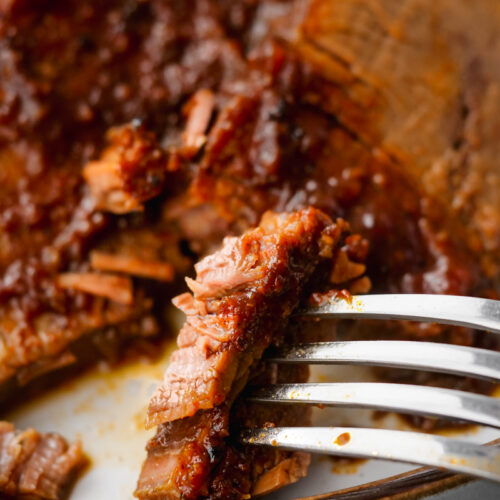 instant pot brisket on plate with fork to the side