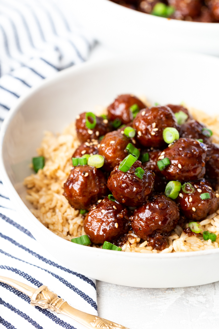 mongolian beef meatballs with most of the white bowl showing