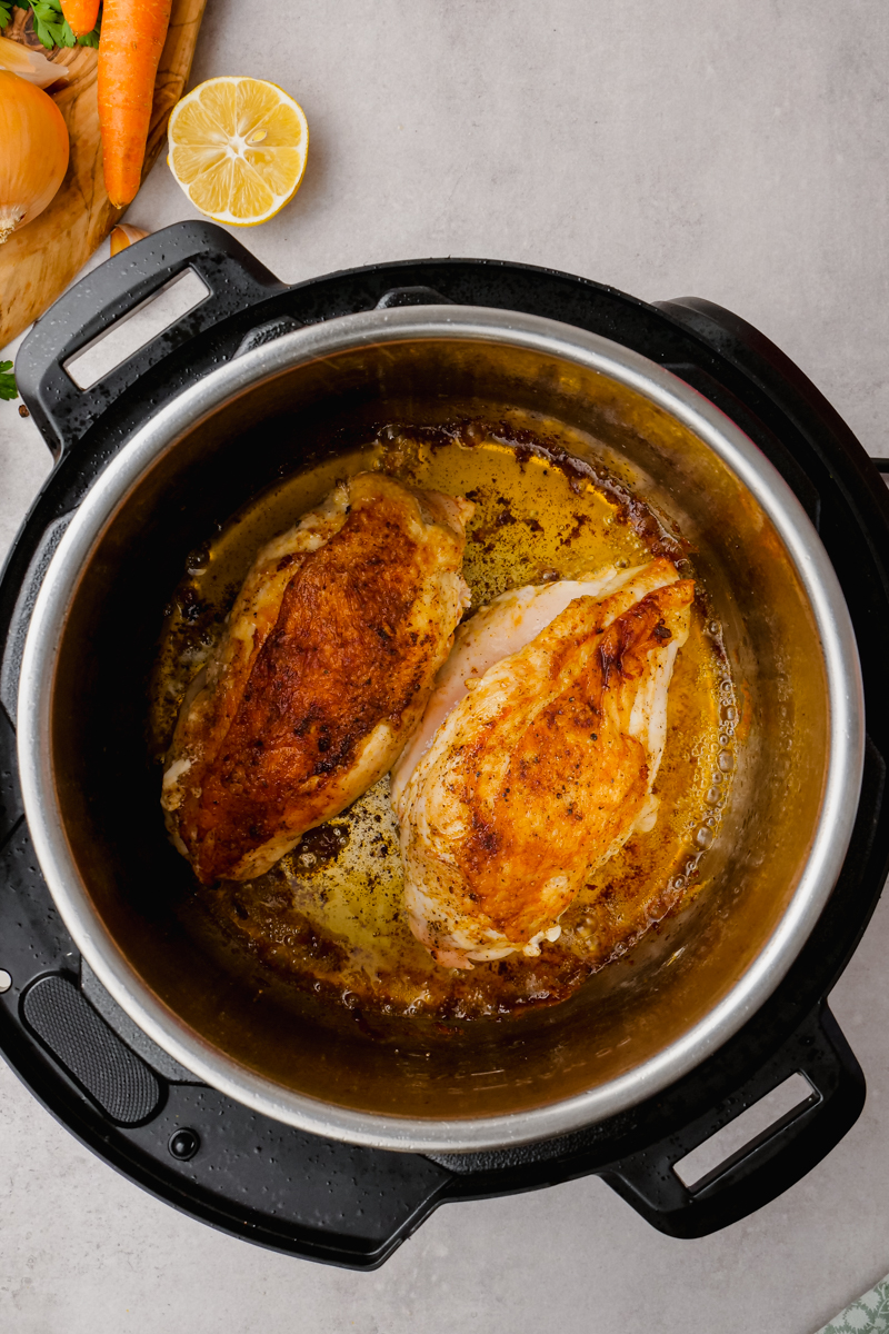 chicken being out back into the instant pot to cook