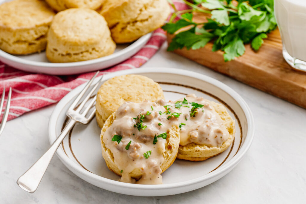 Biscuits topped with sausage gravy and parsley