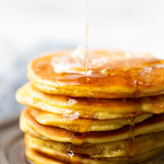 Low carb pancakes made with coconut flour--keto friendly, a stack with butter and syrup
