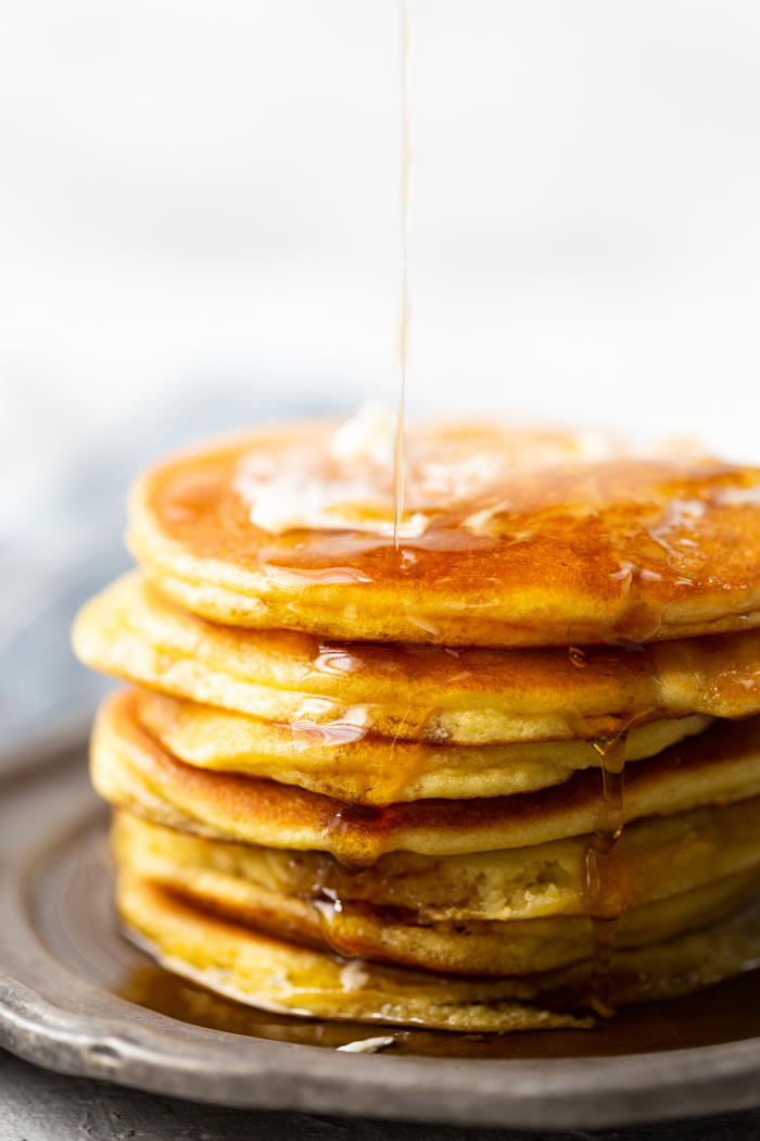 Low carb pancakes made with coconut flour--keto friendly, a stack with butter and syrup