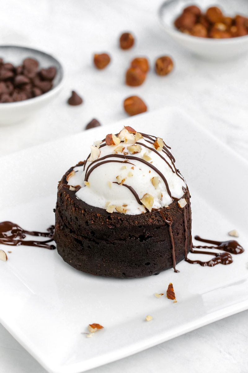 An instant pot lava cake with ice cream on top and drizzles of Nutella