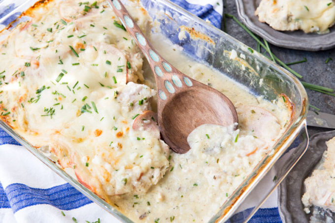 monte cristo chicken in baking dish with wood spoon