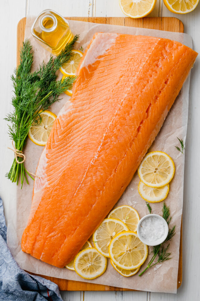 Ingredients for oven poached salmon, lemon, salt, dill, olive oil