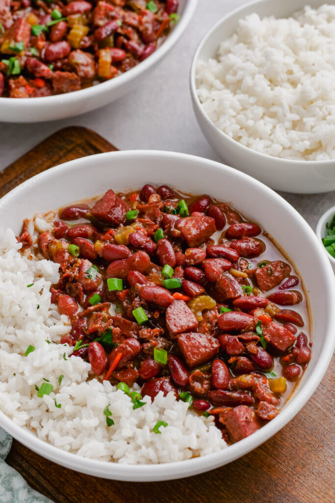 A bowl of red beans and rice, simmered to  perfection and garnished with green onions