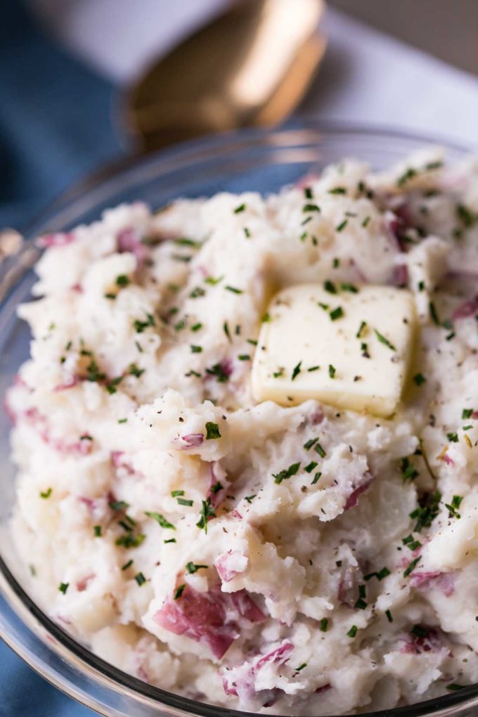 Russet Mashed Potatoes with skin on are rich, fluffy, buttery, and the perfect addition to your dinner table. And they are fluffy deliciousness rather than potato paste.