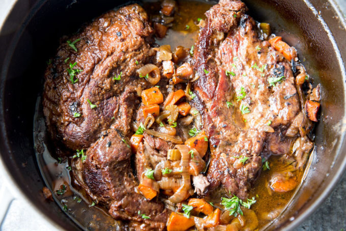 Red wine braised beef, an easy meal cooked in a dutch oven. Easy, flavorful, and delicious. 