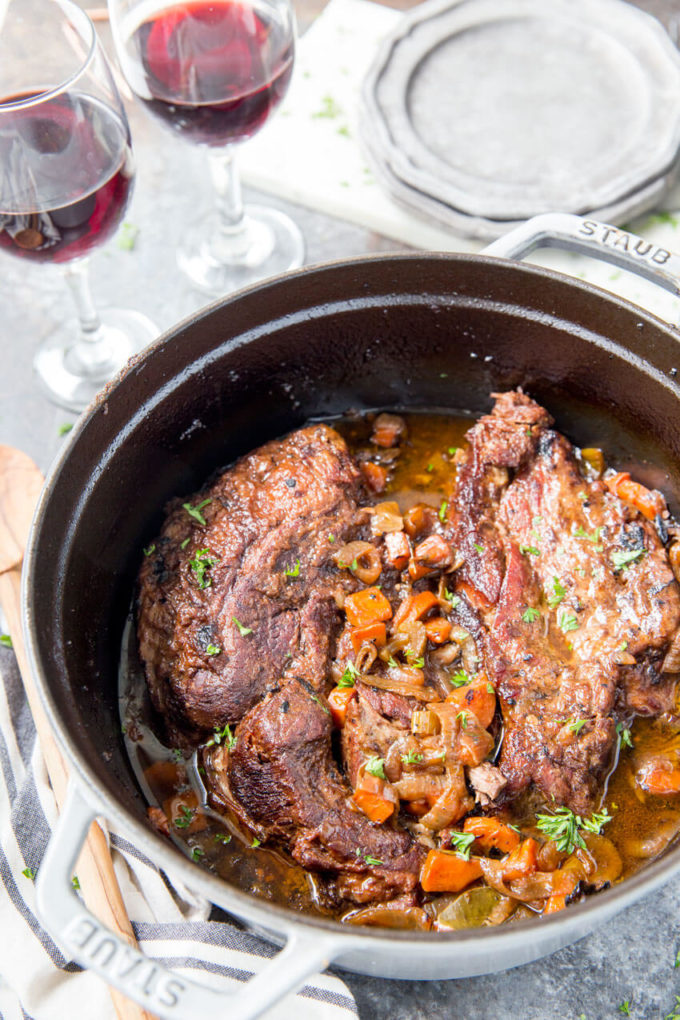 Red Wine Braised Beef Recipe: When cooked to perfection in a dutch oven, is fork tender and deliciously flavorful. There is just something about braising beef that makes it so amazing. Later this week I will share a tomato braised beef, but today I wanted to share this red wine braised beef. And it was not braised by just any