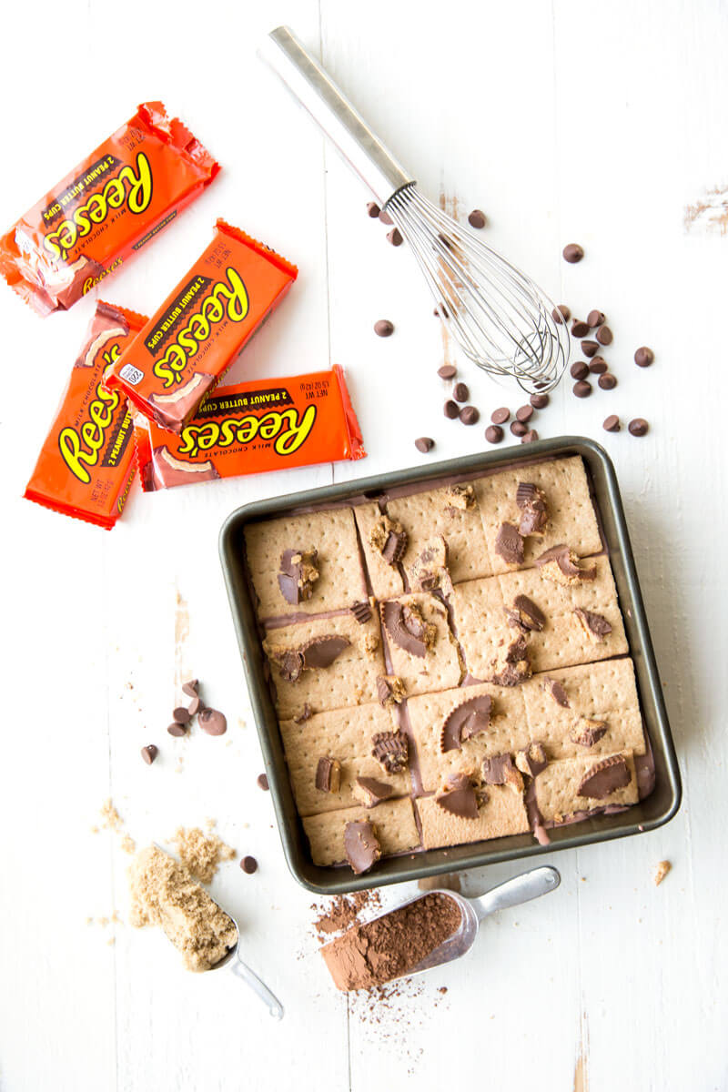 Reese's Ice Box Cake, layers of sweets covered in hot fudge sauce and peanut butter goodness