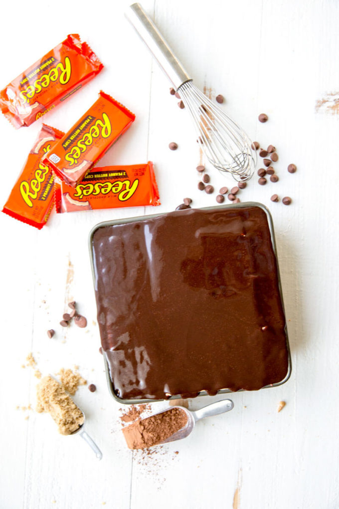 Reese's Ice Box Cake, layers of sweets covered in hot fudge sauce and peanut butter goodness