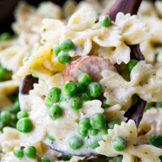 Quick, easy, and oh so delicious, this skillet pasta is a real winner with chicken sausage, peas, alfredo, and pesto