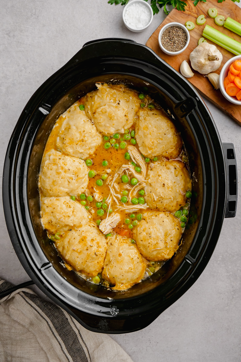 A slow cooker with chicken and dumplings