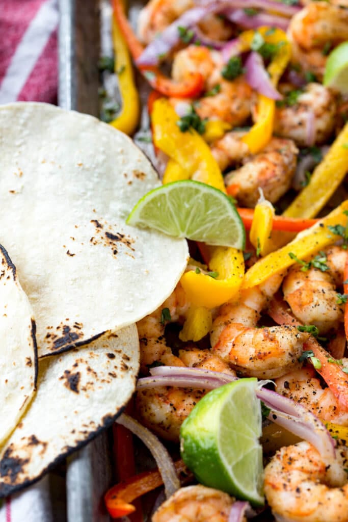 Easy to make shrimp fajitas are a delicious sheet pan meal ready in 15 minutes