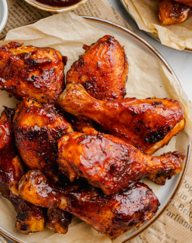 Slow Cooker BBQ Drumsticks on a brown plate.