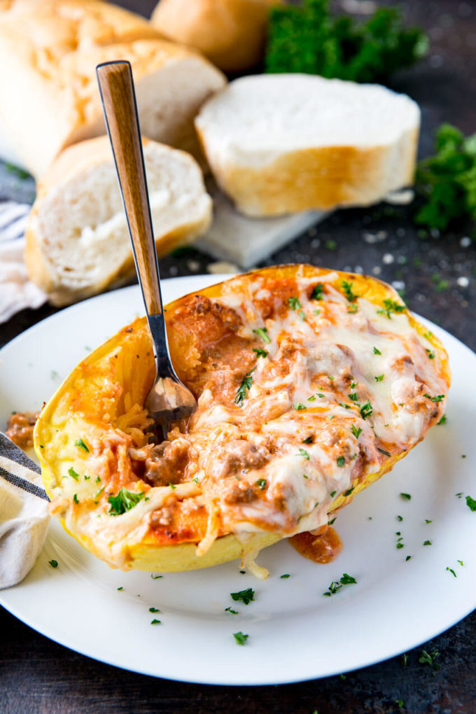 Spaghetti Squash stuffed with Lasagna fillings, this is the best way to eat spaghetti squash ever! Spaghetti squash lasagna