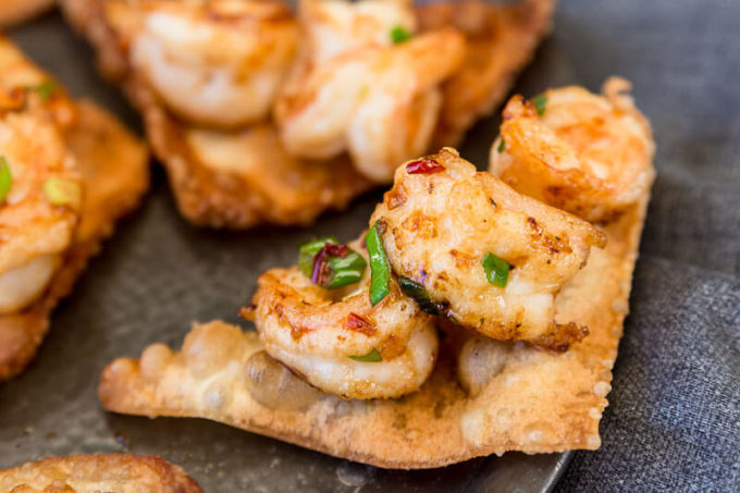 Here’s something to impress your friends that’s simple to make and packed full of spicy heat and mouthwatering flavor. These Spicy Prawns on Crispy Wontons are a must have for your next dinner party.