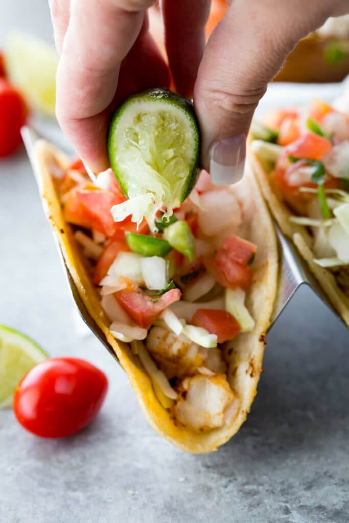 Tilapia Tacos Recipe: Easy to make, mildly flavored, delicious, flaky, and loaded with flavor.  These tilapia fish tacos are healthy, easy, and delicious.