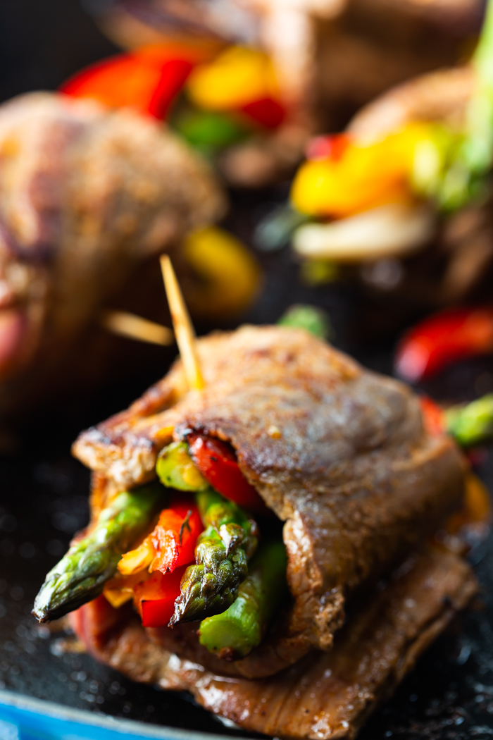 Steak roll ups, a low carb steak fajitas roll up on a cast iron skillet