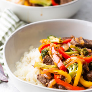 steak stir fry with most of the second bowl in background