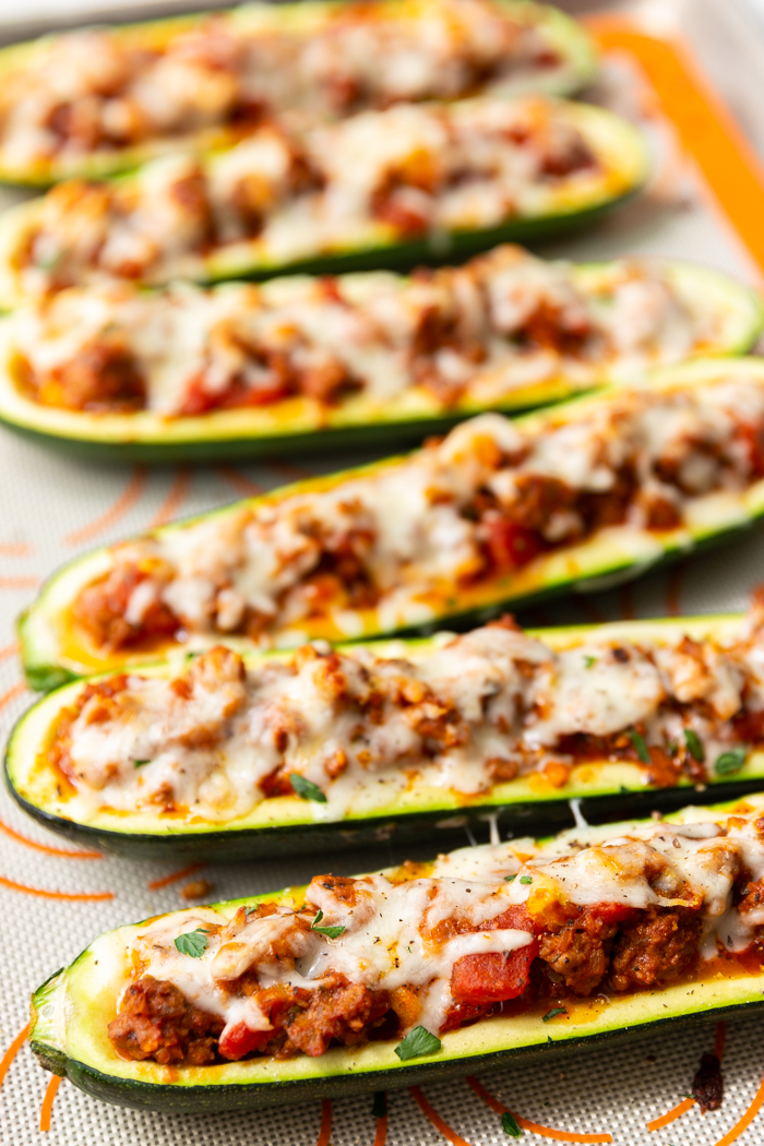 a tray full of beef stuffed zucchini boats