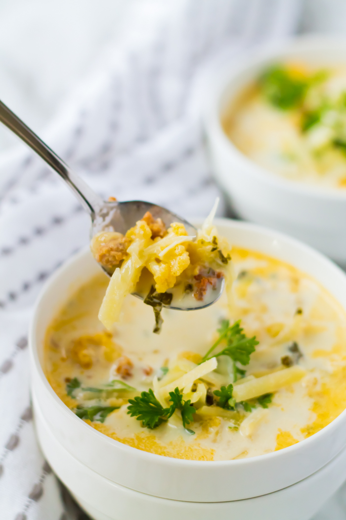 zuppa toscana soup with a spoon