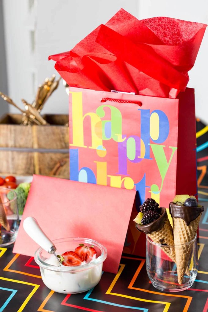 A fun birthday tablescape with chocolate dipped fruit cones