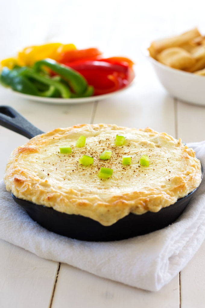 Your favorite pasta dish gets a makeover with this creamy Cajun Chicken Alfredo Dip with cream cheese, mozzarella, chicken and spice. Only five ingredients in this super cheesy dip with a creole kick! 