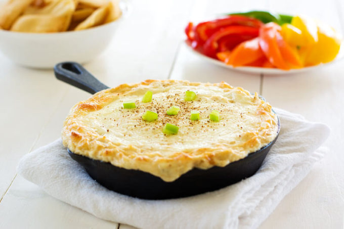 Your favorite pasta dish gets a makeover with this creamy Cajun Chicken Alfredo Dip with cream cheese, mozzarella, chicken and spice. Only five ingredients in this super cheesy dip with a creole kick! 